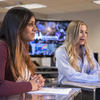 An image of two students involved in a newscast