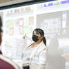 A Klein professor leading a class on art direction.