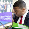 Student reading pamphlet at career fair